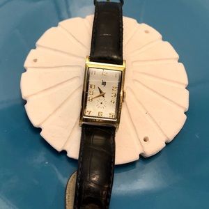 Classic LIP watch with gold face and black band